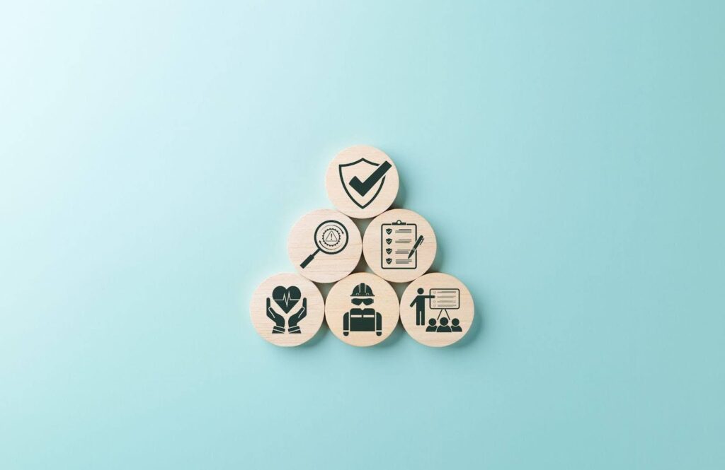 A pyramid of wooden blocks with different icons, stacked neatly