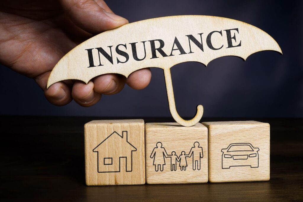 Visual of a house and car with insurance symbols representing coverage for homeowners and vehicle owners