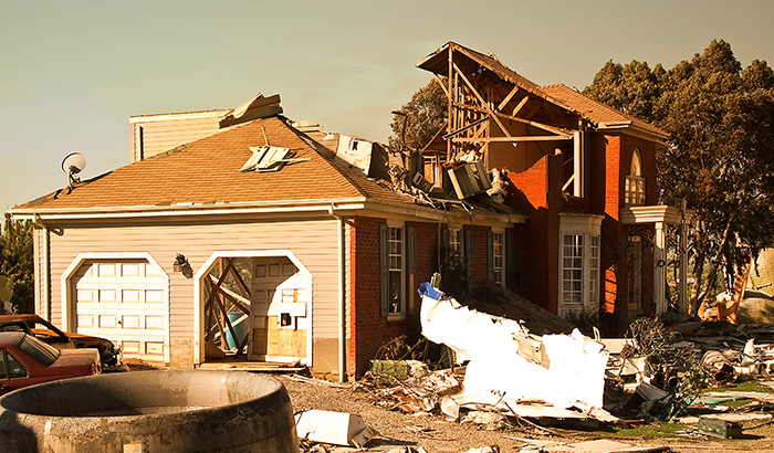 A Tornado Destroys A House, Highlighting The Importance Of Earthquake Insurance Options For Homeowners