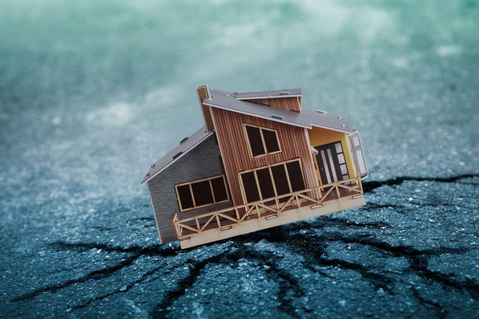 A house above a major earth crack, highlighting the risks of unstable ground